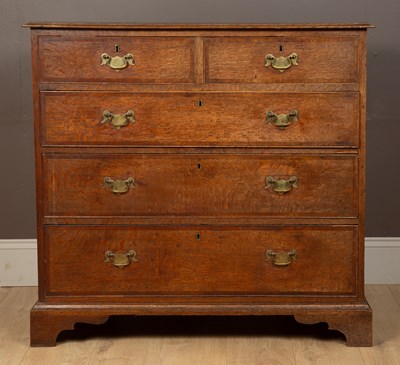 Lot 311 - A George III oak chest of drawers