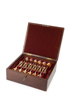 Lot 880 - A set of twelve early Victorian silver-gilt...