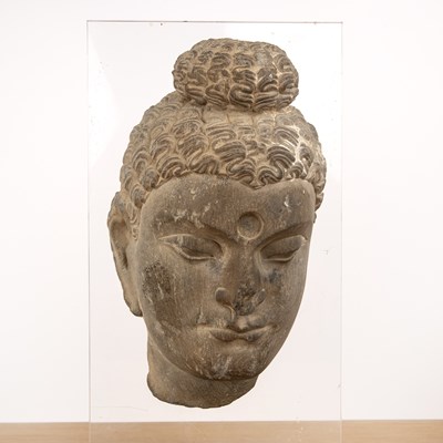 Lot 392 - Fragmentary grey carved schist head of Buddha...