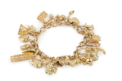 Lot 213 - A 9ct gold curb link charm bracelet, with...