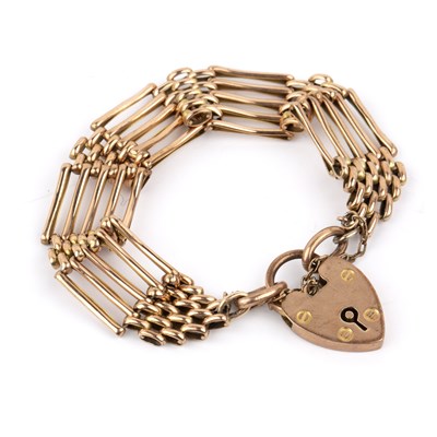 Lot 191 - 9ct gold gate bracelet with heart padlock...