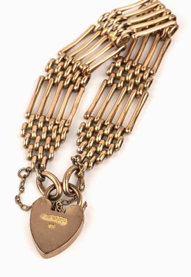 Lot 191 - 9ct gold gate bracelet with heart padlock...