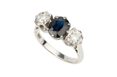 Lot 228 - A sapphire and diamond three stone ring, the...