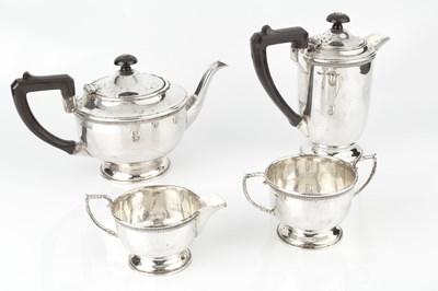 Lot 882 - A George V silver four piece tea service, with...