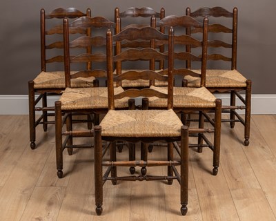 Lot 432 - A set of six elm and ash ladder-back dining chairs