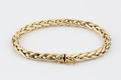 Lot 120 - An 18ct gold bracelet, of hollow plaited...