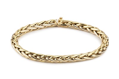 Lot 120 - An 18ct gold bracelet, of hollow plaited...