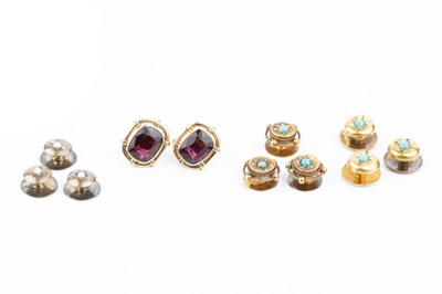 Lot 122 - A pair of garnet ear studs, in unmarked yellow...