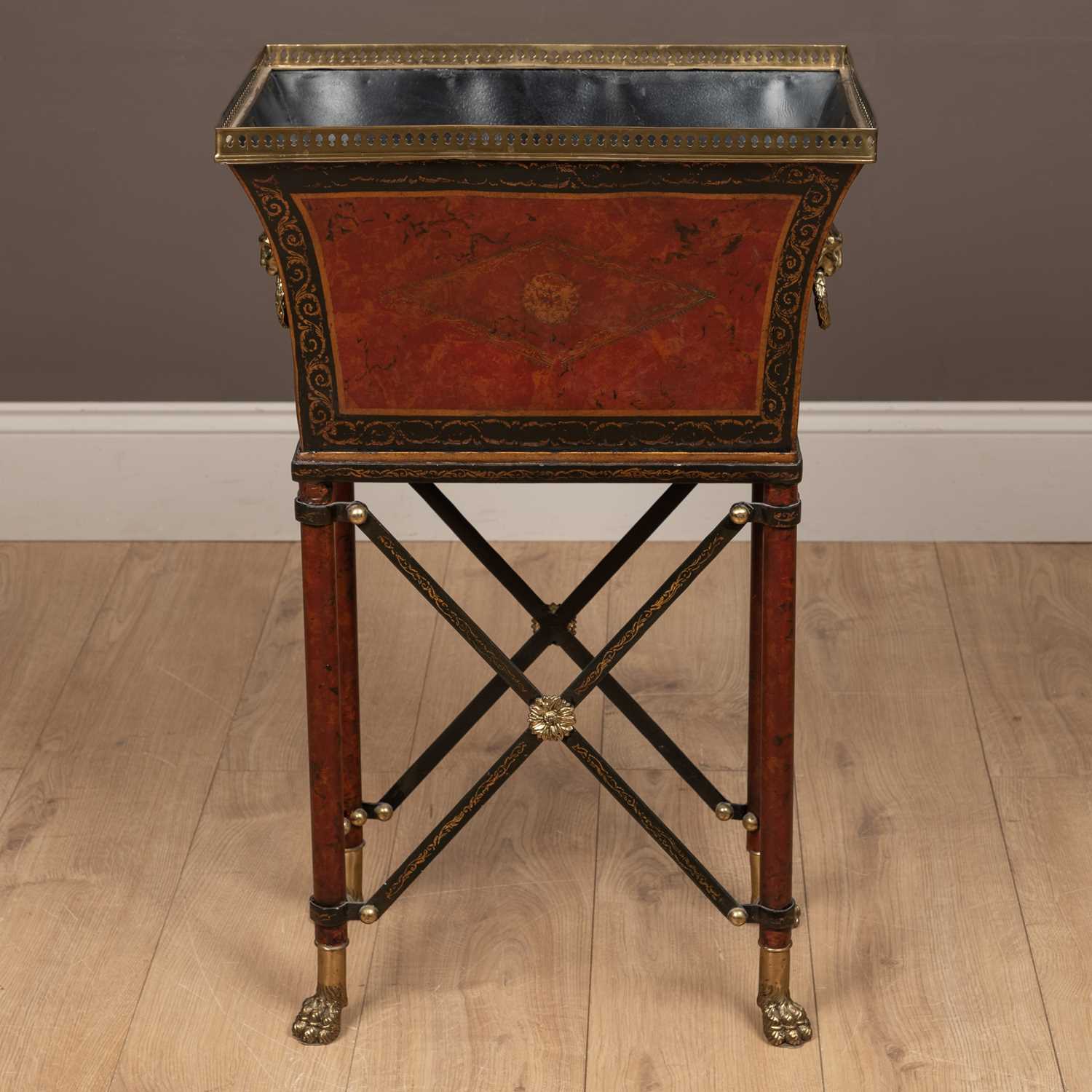 Lot 544 - A toleware jardinière stand