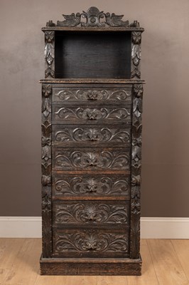 Lot 1063 - A Victorian carved oak Wellington chest