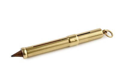 Lot 596 - A gold propelling pencil, with engine turned...