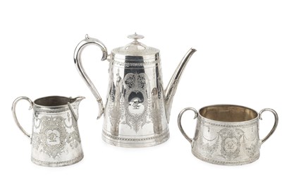 Lot 822 - A mid Victorian silver teapot and matching...