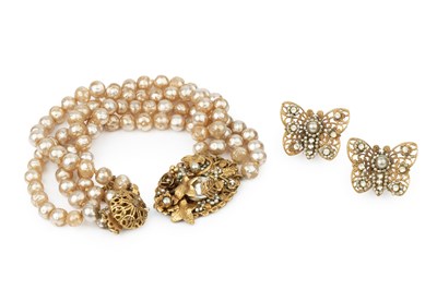 Lot 223 - A faux baroque pearl bracelet by Miriam...