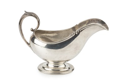 Lot 825 - An American silver sauceboat, with shaped...