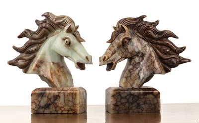 Lot 213 - Bookends in the form of a horse's head carved...