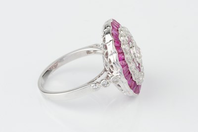 Lot 101 - A ruby and diamond cocktail ring, of target...