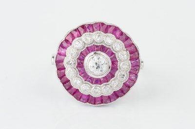 Lot 101 - A ruby and diamond cocktail ring, of target...