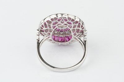 Lot 101 - A ruby and diamond cocktail ring, of target...