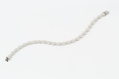 Lot 102 - An 18ct white gold and diamond bracelet, set...