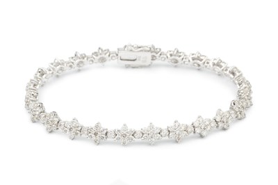 Lot 102 - An 18ct white gold and diamond bracelet, set...