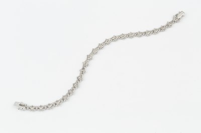 Lot 102 - An 18ct white gold and diamond bracelet, set...