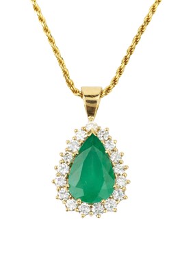 Lot 331 - An emerald and diamond pendant, the mixed cut...