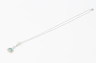 Lot 151 - An 18ct white gold, diamond and blue topaz...