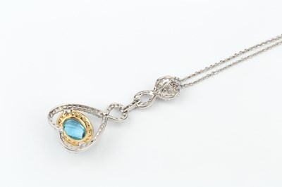 Lot 151 - An 18ct white gold, diamond and blue topaz...