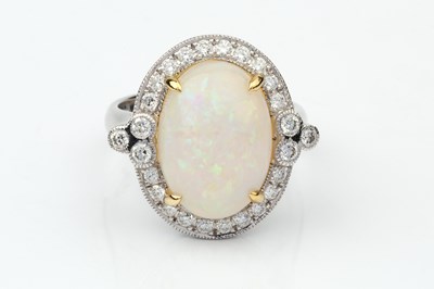 Lot 153 - An opal and diamond dress ring, the oval...