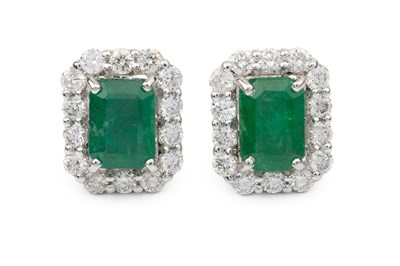 Lot 333 - A pair of emerald and diamond ear studs, of...