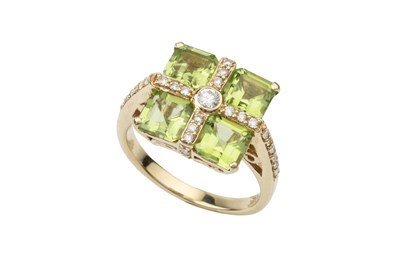 Lot 211 - A peridot and diamond dress ring, the four...