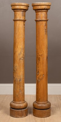 Lot 1018 - A pair of elm stands or torchères