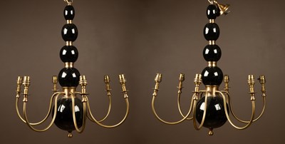 Lot 179 - A pair of Pooky "Dunnock" brass and black lacquered wood six-branch chandeliers