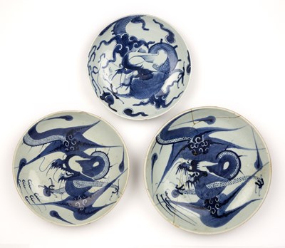 Lot 23 - Three blue and white porcelain dragon dishes...