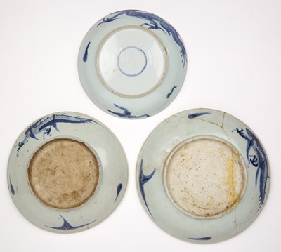 Lot 23 - Three blue and white porcelain dragon dishes...