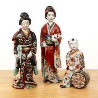 Lot 79 - Two porcelain models of standing Geishas...