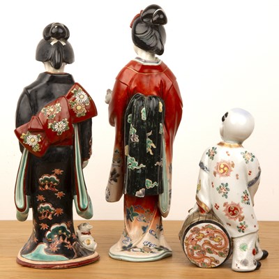 Lot 79 - Two porcelain models of standing Geishas...