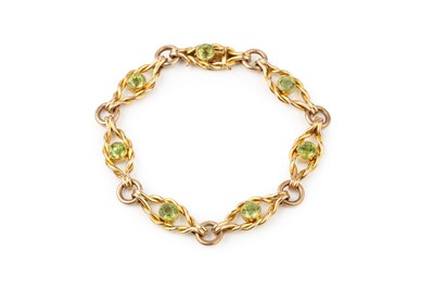 Lot 246 - A 15ct gold and peridot bracelet, composed of...