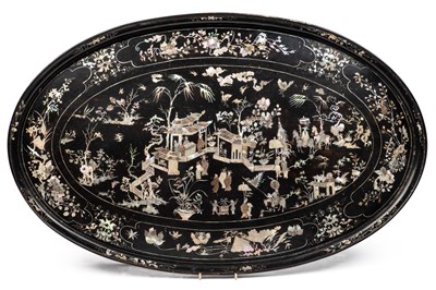 Lot 230 - A black lacquered oval tray with mother of pearl inlay