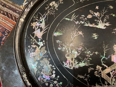 Lot 230 - A black lacquered oval tray with mother of pearl inlay