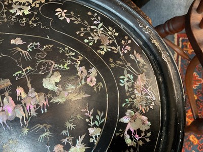 Lot 230 - A black lacquered oval tray with mother of pearl inlay