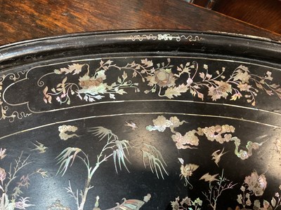 Lot 230 - A black lacquered oval tray with mother of pearl inlay