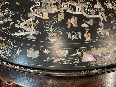 Lot 230 - A black lacquered oval tray with mother of pearl inlay