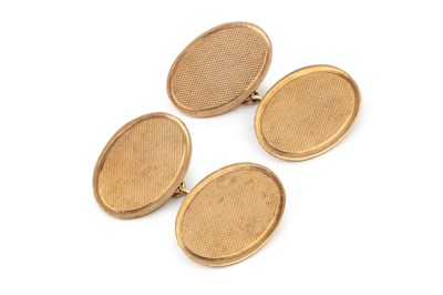 Lot 249 - A pair of 9ct gold oval cufflinks, with engine...