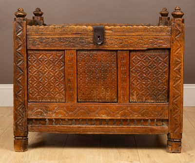 Lot 1048 - An Indian style hardwood marriage chest