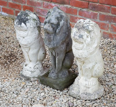 Lot 1298 - Three cast stone lions