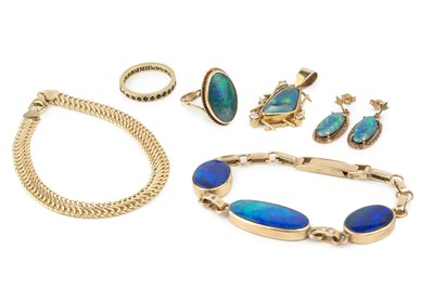 Lot 284 - A 9ct gold and opal bracelet, with three oval...