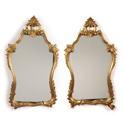 Lot 49 - Pair of gilt scroll mirrors  
with foliate...