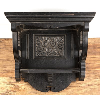 Lot 24 - Aesthetic ebonised wall bracket with carved...