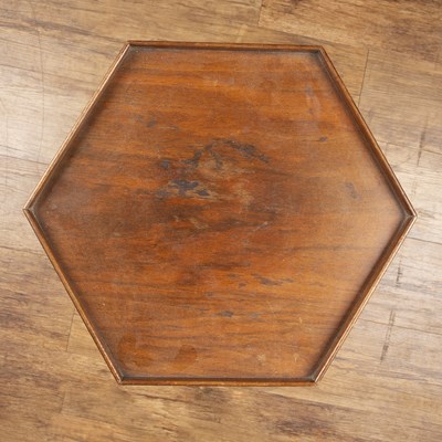 Lot 46 - Hexagonal walnut stand with a well carved...